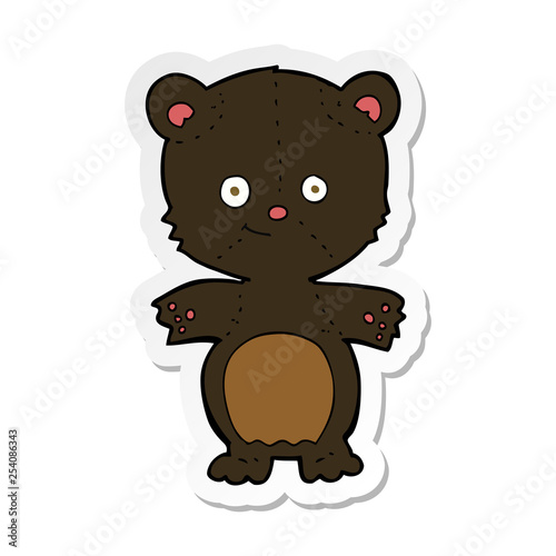 sticker of a cartoon happy black bear