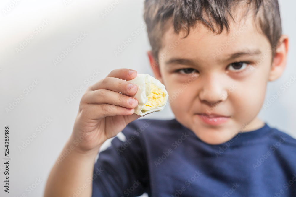 Child eating boiled egg