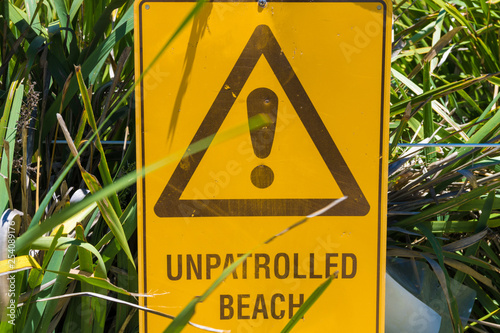 Unpatrolled beach warning sign in Australia photo