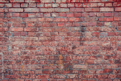 Old textured brick wall with natural defects. Scratches  cracks  crevices  chips  dust  roughness. Can be used as background for design or poster.