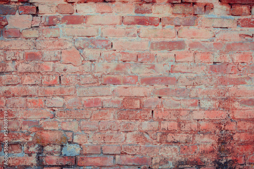 Old brick wall with scratches  cracks  dust  crevices  roughness. Can be used as a poster or background for design.