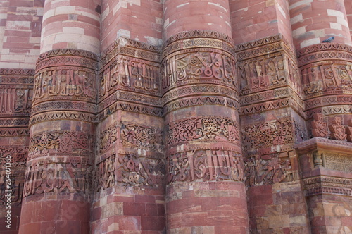 Photography This photograph showcases the intricate stone carvings and calligraphy on the Qutb Minar, a UNESCO World Heritage Site in Delhi, India