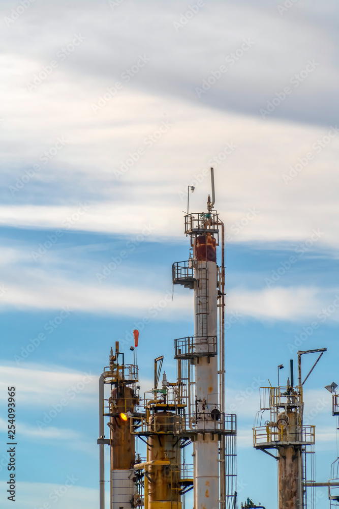 Power Plant against vibrant sky and puffy clouds