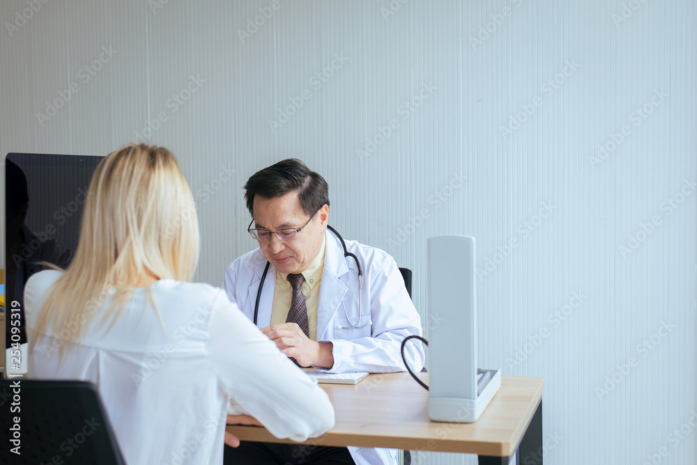 Discuss issue and find solutions to mental health problems,Young woman talking to senior doctor psychiatrist in hospital Discuss issue and find solutions to mental health problems,Young woman talking to senior doctor psychiatrist in hospital