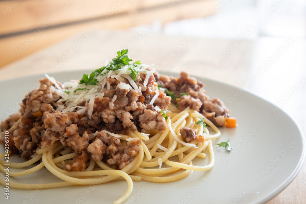 Homemade spaghetti served on wooden table. Homemade spaghetti served on wooden table.