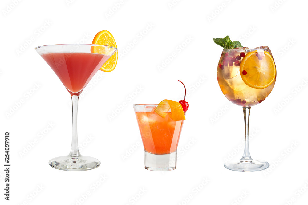 A variety of alcoholic drinks, beverages and cocktails on a white background. Three refreshing drinks in different glass goblets.