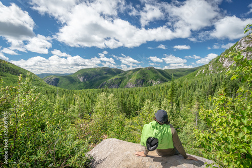 Hiker and beautiful view in Les Grands-Jardins National Park, Quebec