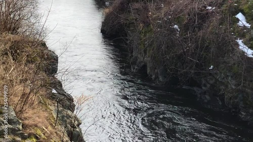 Scenic 4 K footage left pan of a river bank stream in a small New England Town photo