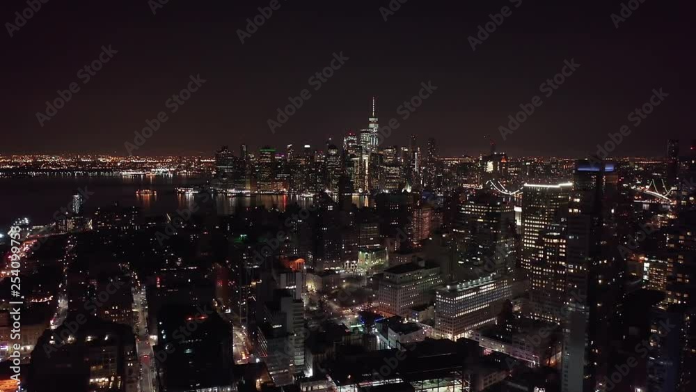 The New York City Skyline at night, taken from a drone. This view of the beautiful manhattan skyline is taken from Brooklyn and shows the freedom tower and Lower Manhattan. The New York City Skyline at night, taken from a drone. This view of the beautiful manhattan skyline is taken from Brooklyn and shows the freedom tower and Lower Manhattan.