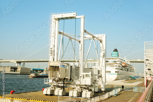 Yacht passenger gangway telescopic (boarding bridge) for pick up and drop off yacht passengers at Osaka port on bright blue sky background, is the main port in Japan, located in Osaka within Osaka Bay