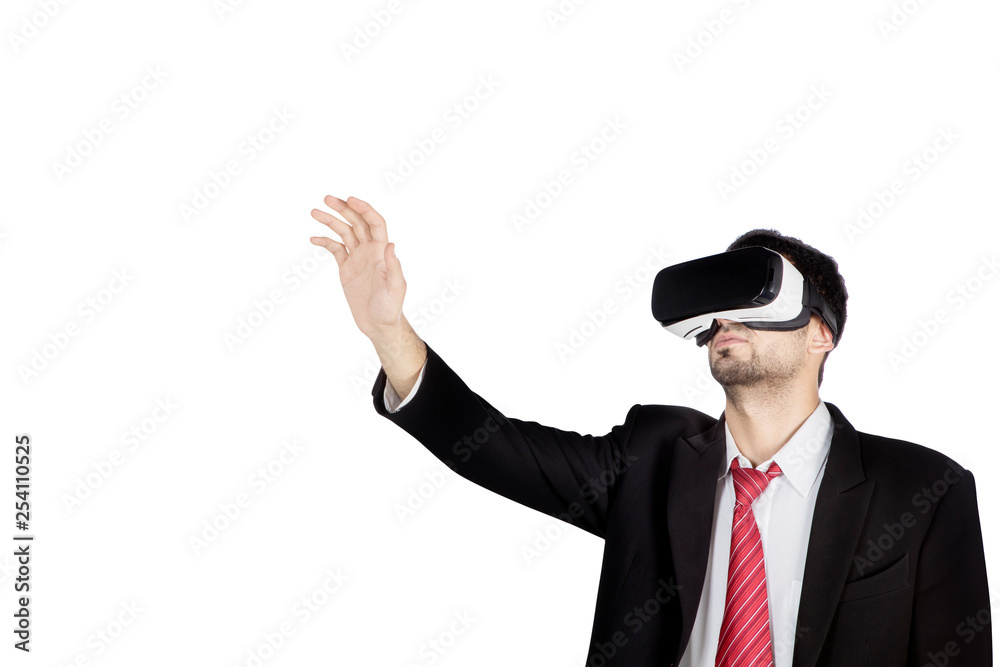 Male manager wears virtual reality goggles on studio Male manager wears virtual reality goggles on studio