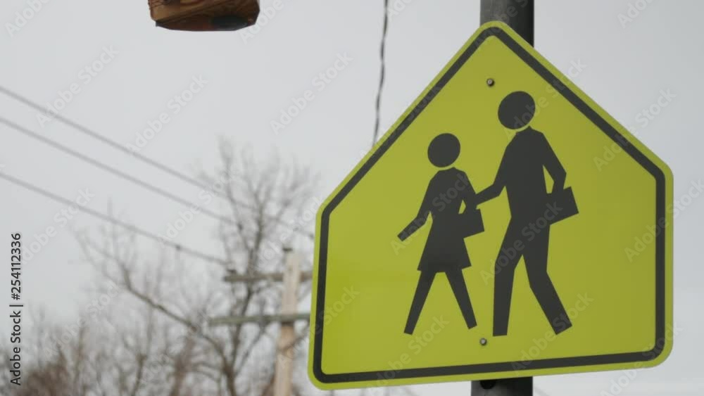 Close up of school crossing sign overcast