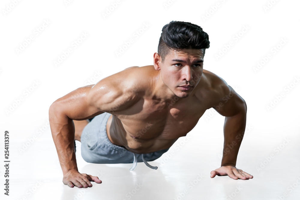 Muscular bodybuilder man doing push ups exercise isolated on white background with clipping path . Shirtless fitness young sport man training .work out healthy Muscular bodybuilder man doing push ups exercise isolated on white background with clipping path . Shirtless fitness young sport man training .work out healthy
