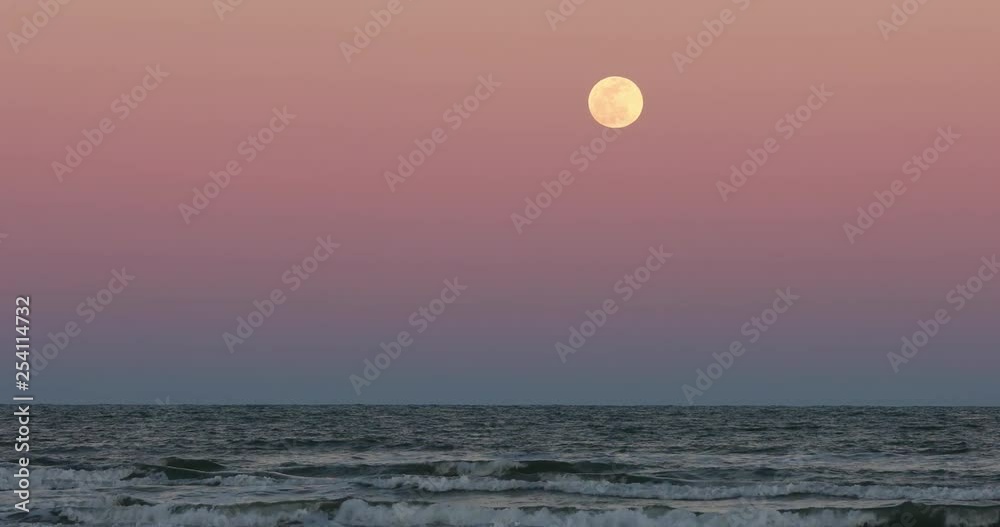 Sunset Ocean full moon Texas coast. Beautiful southern Texas, Gulf of Mexico Ocean beach. Padre Island, Mustang Island, Corpus Christi. Waves and surf on sand. Summer vacation destination. Sunset Ocean full moon Texas coast. Beautiful southern Texas, Gulf of Mexico Ocean beach. Padre Island, Mustang Island, Corpus Christi. Waves and surf on sand. Summer vacation destination.