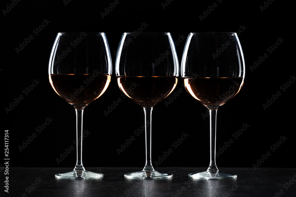 Glasses of wine in darkness Glasses of wine in darkness