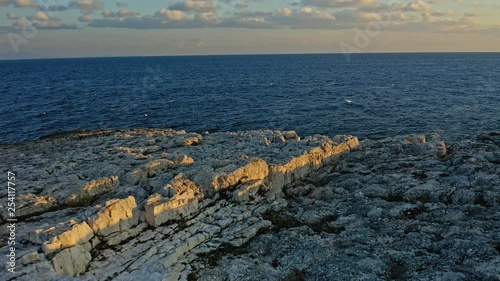 Beautiful view of the Adriatic Sea and the rocky coast of Cres Island on a beautiful sunset. Croatia. Aerial view traveling