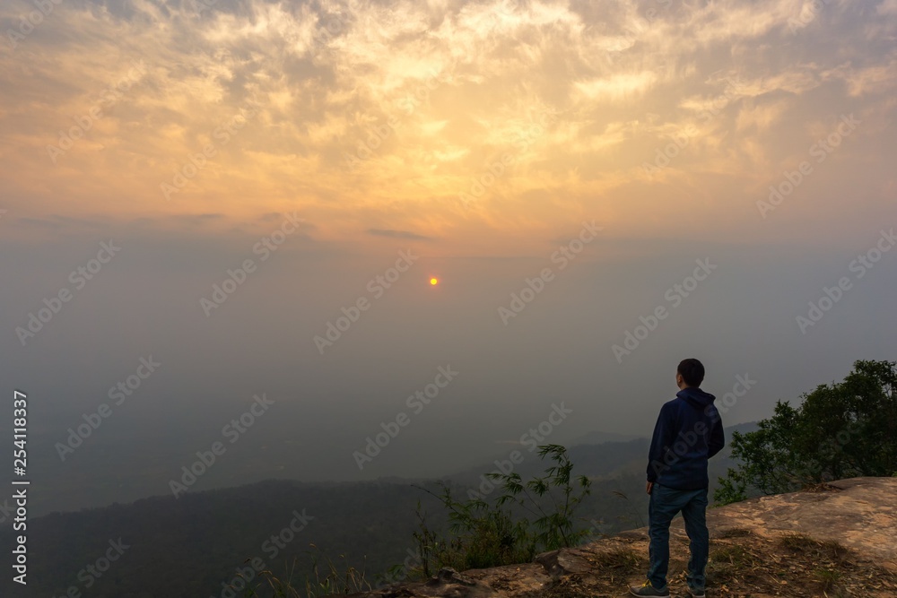 Traveler looking panorama twilight sky at the cliff nature background