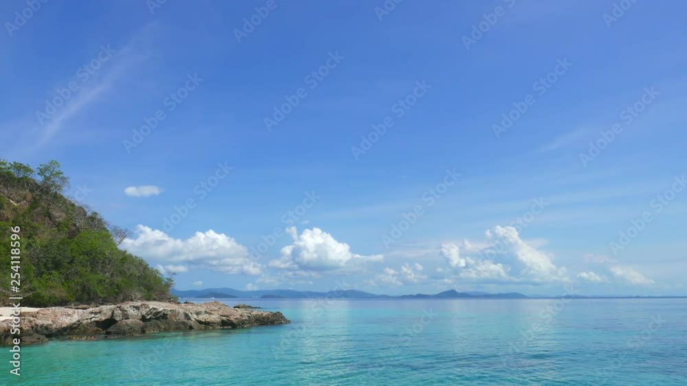 Beautiful sea and sky background with island in right of shot Beautiful sea and sky background with island in right of shot