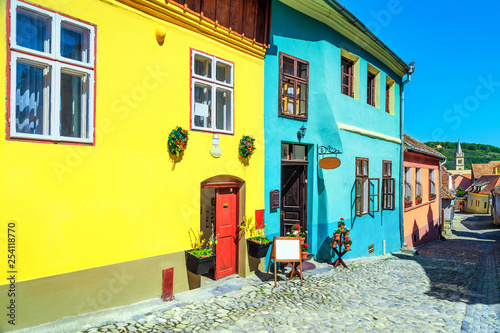 Medieval saxon street with colorful buildings in Sighisoara, Transylvania, Romania