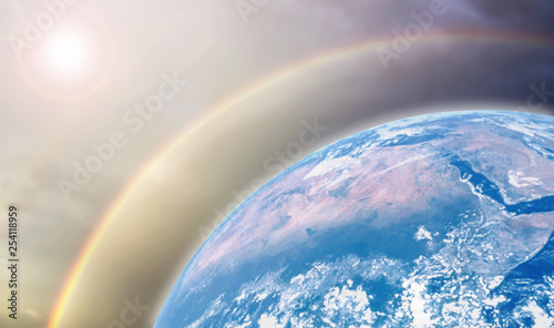 Celebration of earth day with Beautiful mother earth protect heat wave from the sun by ozone layer background.Earth image furnished by NASA. photo