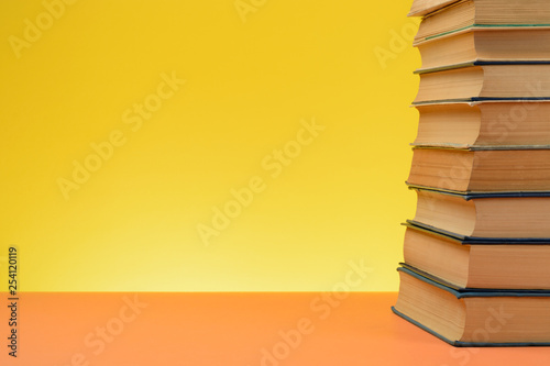 Vintage Books on Colored Paper Background.
