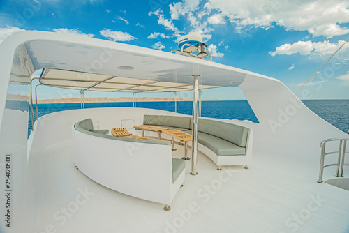 Table and chairs on sundeck of a luxury motor yacht