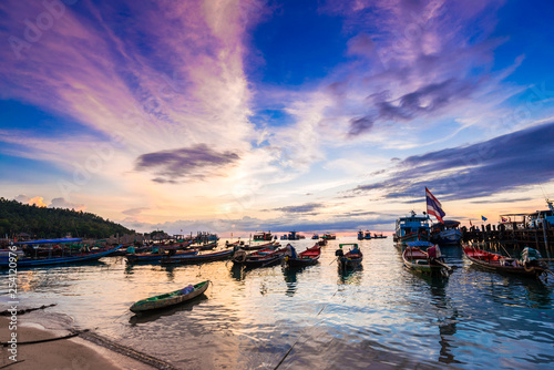 Silhouette sunset long tail boat colorful sky with cloud on beach at Koh Tao island