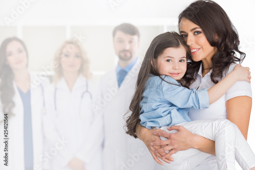 Mother and daughter in medical clinic