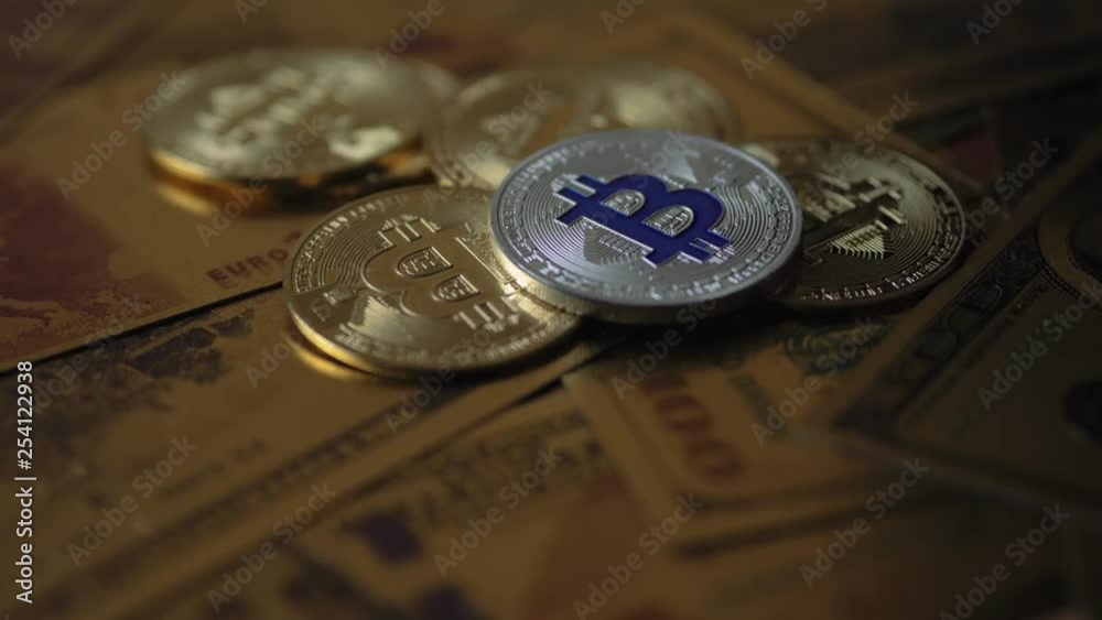 4k concept vidoe. Camera moving around bitcoin coins and golden money dollars and euro on the background. 4k concept vidoe. Camera moving around bitcoin coins and golden money dollars and euro on the background.