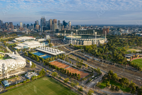 Dawn view of the MCG and AAMI stadium, with the CBD in the background