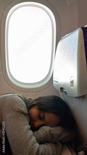 Young tween girl on airplane