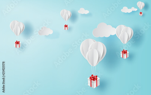 3D paper art and craft of balloon white floating on sky,Balloon with Gift Box Floating on air blue background,happy new years and merry Christmas,Festival enjoy concept,Color use pastel sweet vector