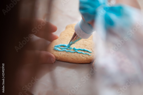 child hands playing with gingerbread