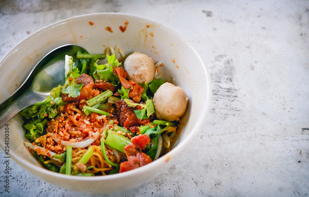 Asian noodles with vegetables on the cement table. Top view with copy area. Asian noodles with vegetables on the cement table. Top view with copy area.