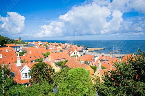 Aerial view of small town - with beautiful, small houses - at the seaside, Gudhjem, Bornholm, Denmark photo