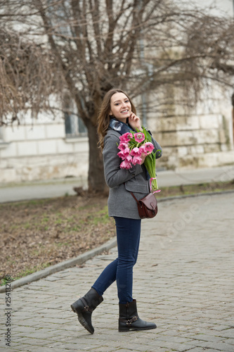Woman with tulips. Beautiful woman with flowers. © darkfreya