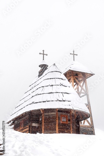 orthodox church building covered with snow