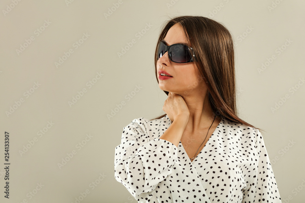 Slim young woman and summer sunglasses Slim young woman and summer sunglasses
