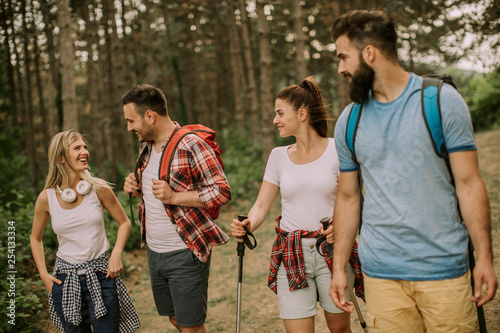 Group of four friends hikin...
