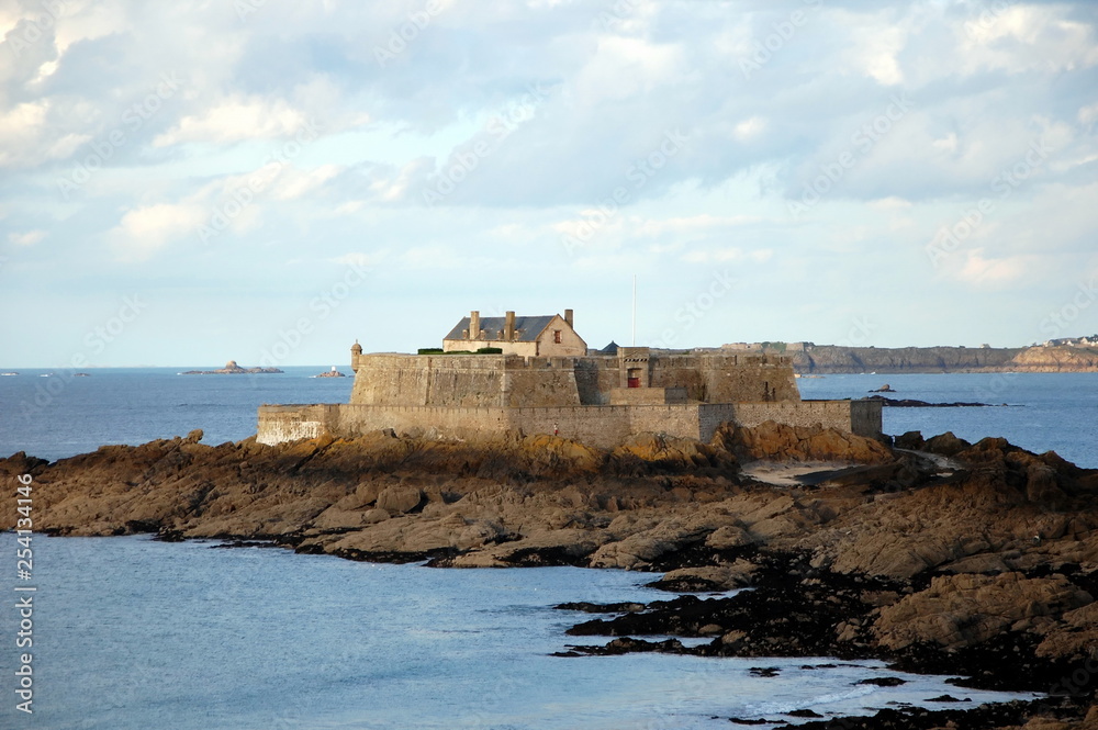 Fort National - fortress on tidal island Petit Be in Saint-Malo. Fort was built in 17th century to protect city. Saint-Malo is a port city in Brittany in France on English Channel