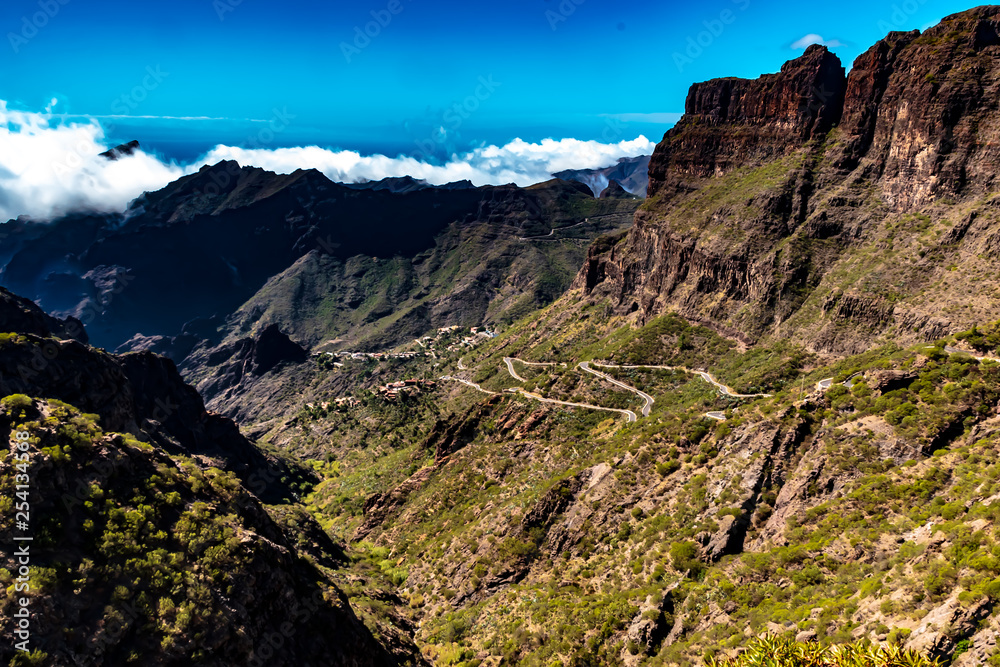 Tenerife, Canary Islands, Spain - The winding mountain road, the mountainous landscape inland on the coast in the west, on the island of Tenerife, on a sunny day in October.