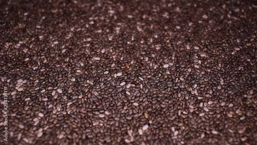 Chia seeds seed healthy food closeup texture video on rolling rotating looping plate Chia seeds seed healthy food closeup texture video on rolling rotating looping plate