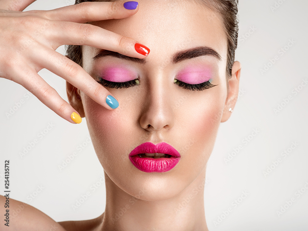 Beautiful fashion woman with a colored nails. Attractive white girl with multicolor manicure. Beautiful fashion woman with a colored nails. Attractive white girl with multicolor manicure.