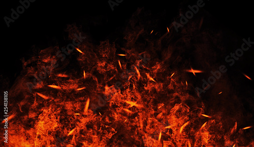 Vintage burn flames with particles embers on isolated black background. Fire texture effect background.