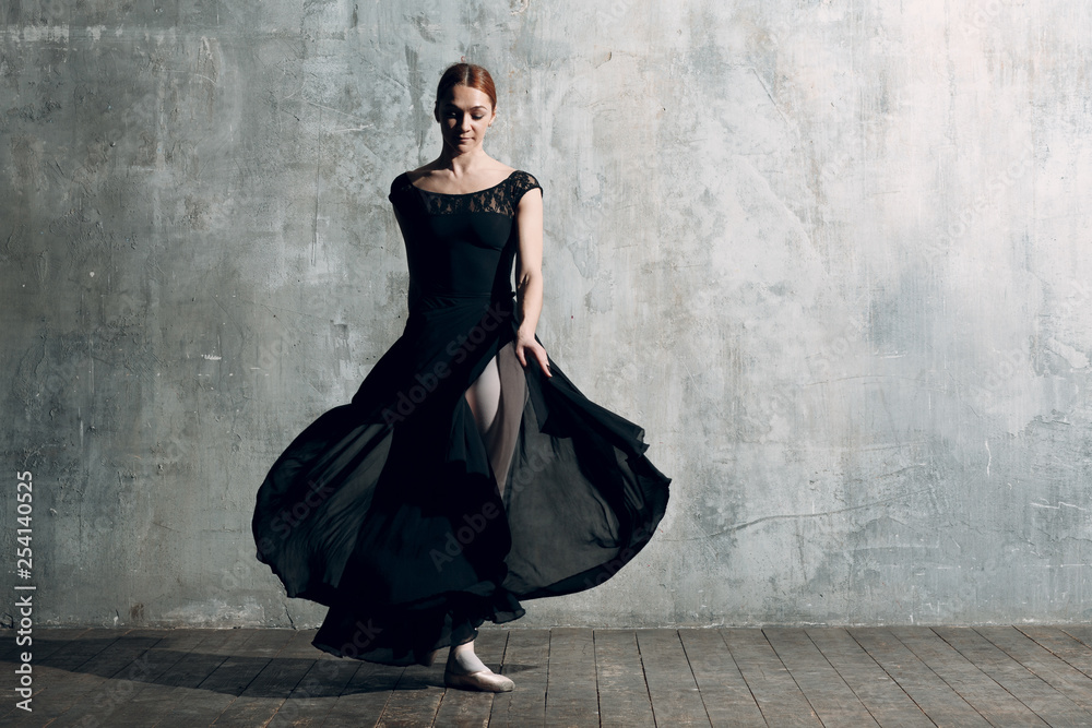 Ballerina female. Young beautiful woman ballet dancer, dressed in professional outfit, pointe shoes and black tutu. Ballerina female. Young beautiful woman ballet dancer, dressed in professional outfit, pointe shoes and black tutu.