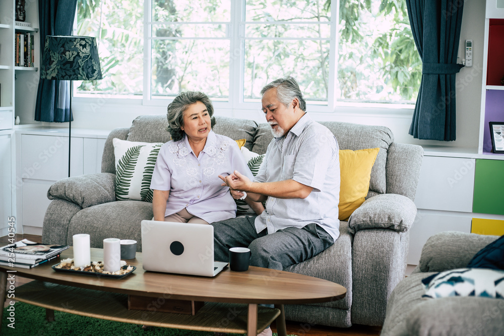 Elderly Couple Talking together and drinking coffee or milk Elderly Couple Talking together and drinking coffee or milk