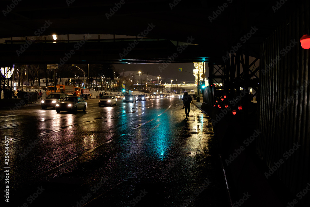Human and car silhouettes at night