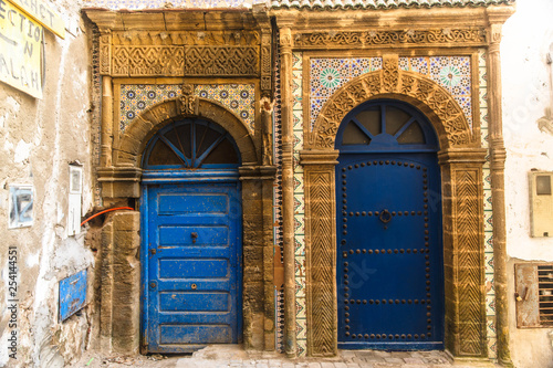 Ancient blue doors on the streets of Essaouira, Morocco © fazeful