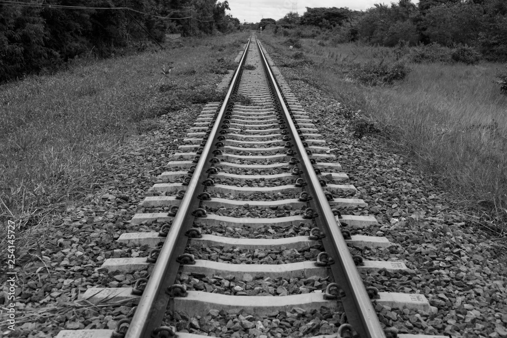 View of the railway tracks that stretched out In Thailand, black and white background View of the railway tracks that stretched out In Thailand, black and white background