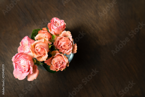 pink roses in a vase © Magneya Photography
